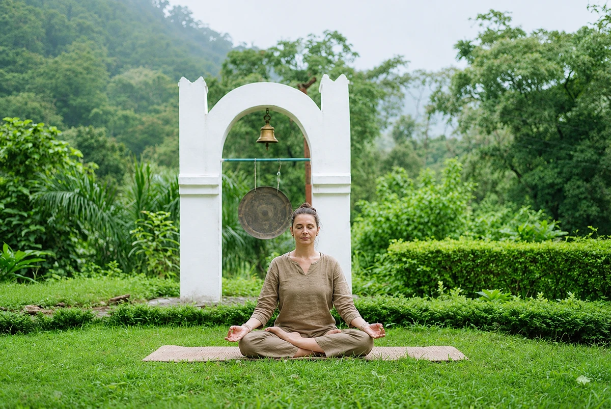 Silent sunrise meditation rows inside the Adhiroha yoga shala in Rishikesh