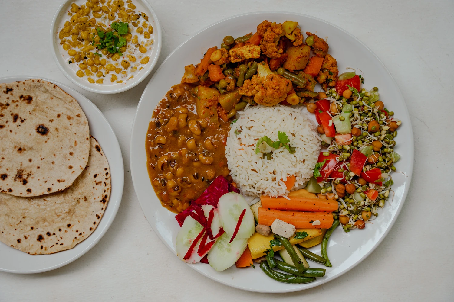 A fresh Satvik thali — rice, dal, vegetables and salad