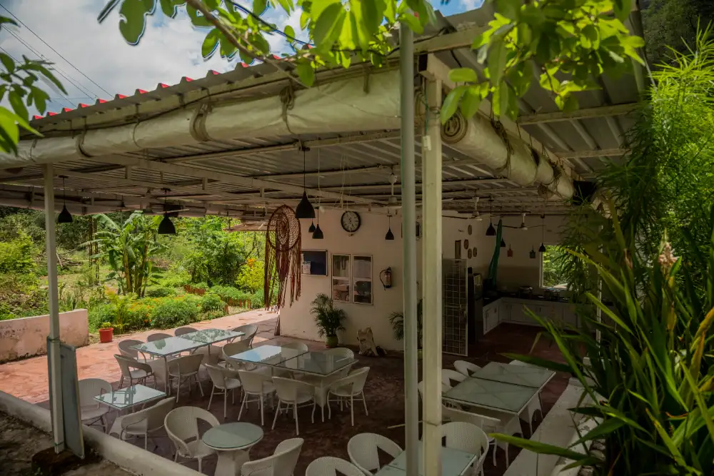Garden cafe with pergola seating in Tapovan, near the Adhiroha yoga ashram in Rishikesh