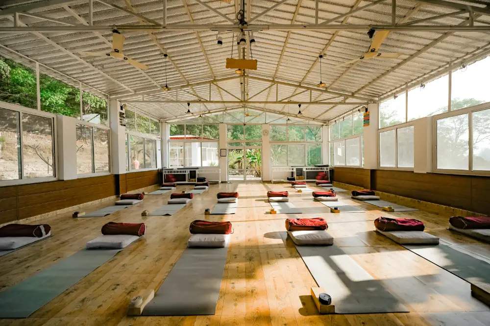 The bright, purpose-built shala laid out with mats and props