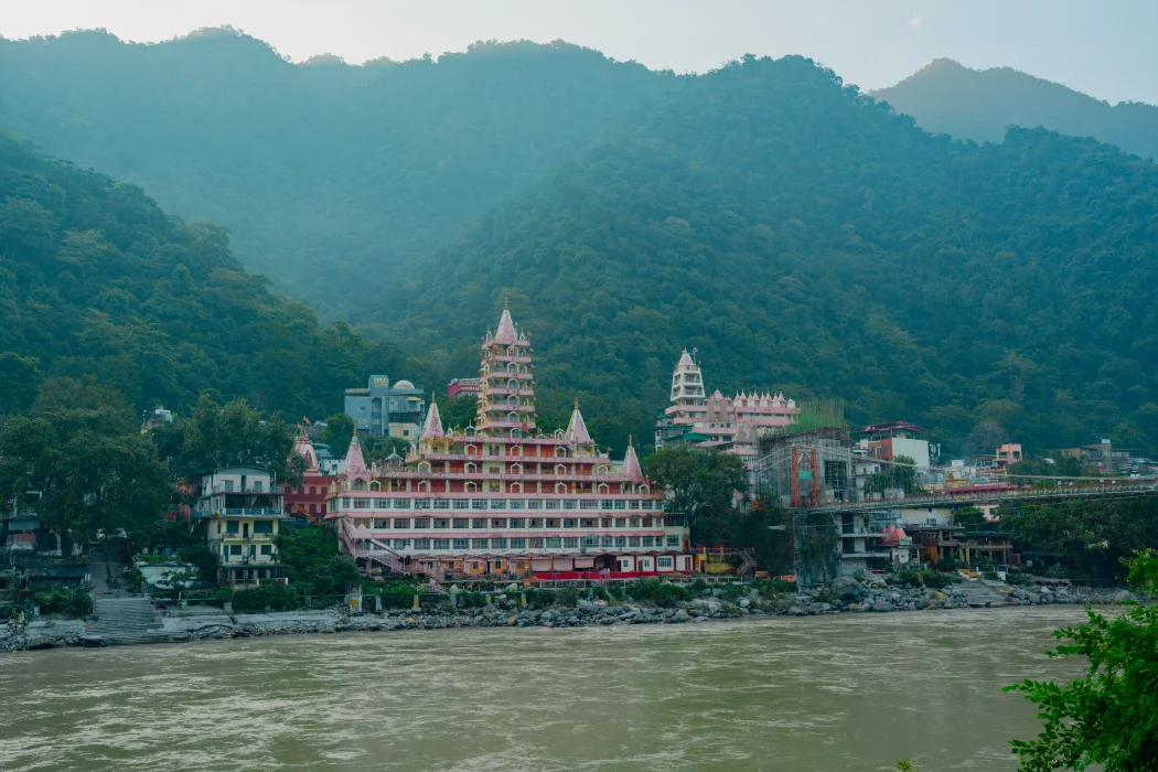 Historic temples rising beside the Ganga Ji at Rishikesh