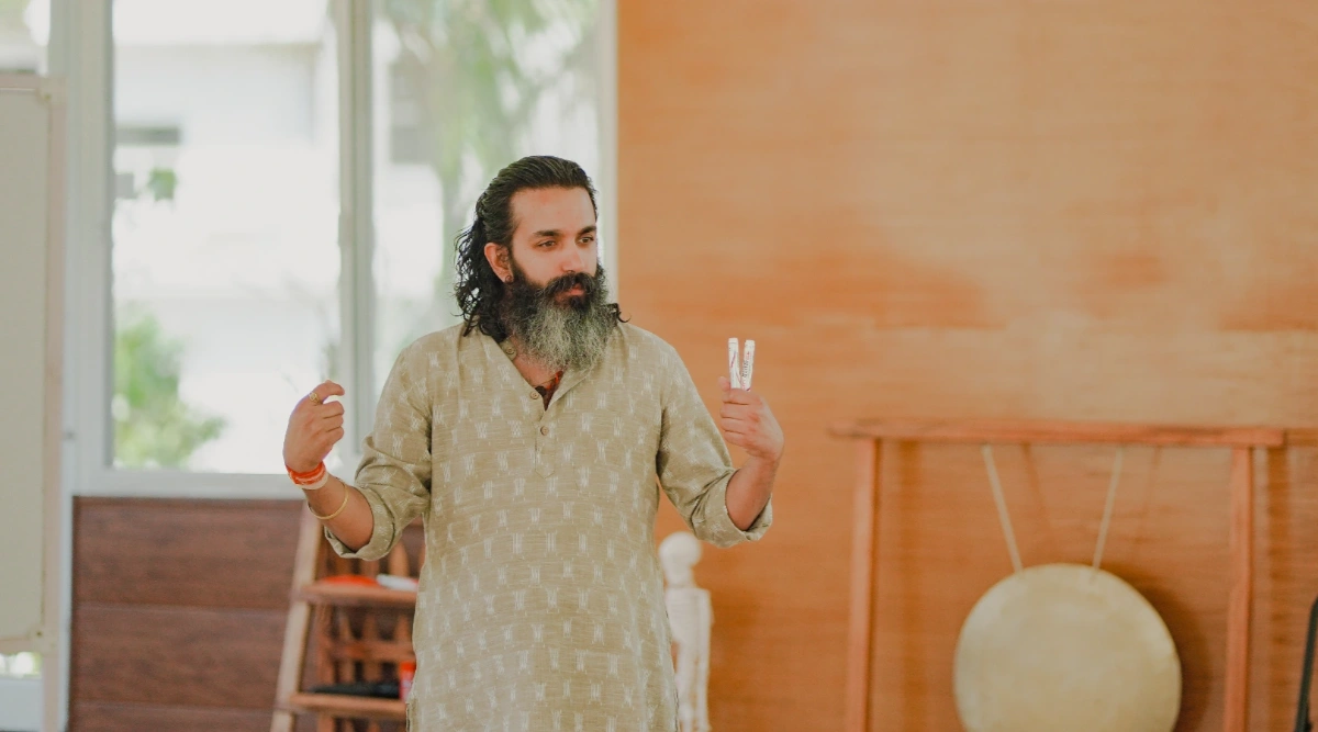 Guru Shankar Das, founder and director of Adhiroha, seated in quiet meditation