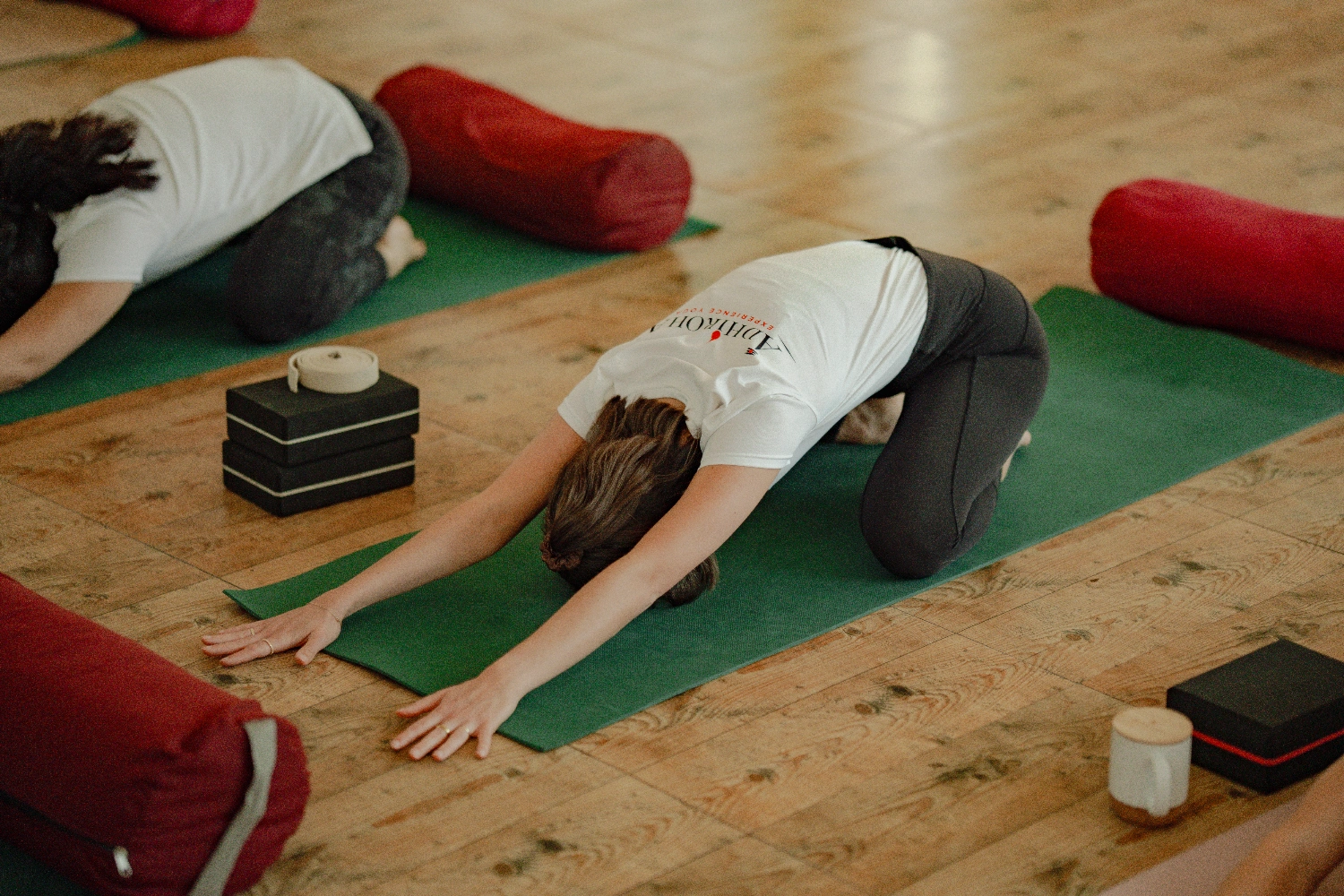 Students of the Hatha and Yin yoga teacher training practising together in the Adhiroha shala